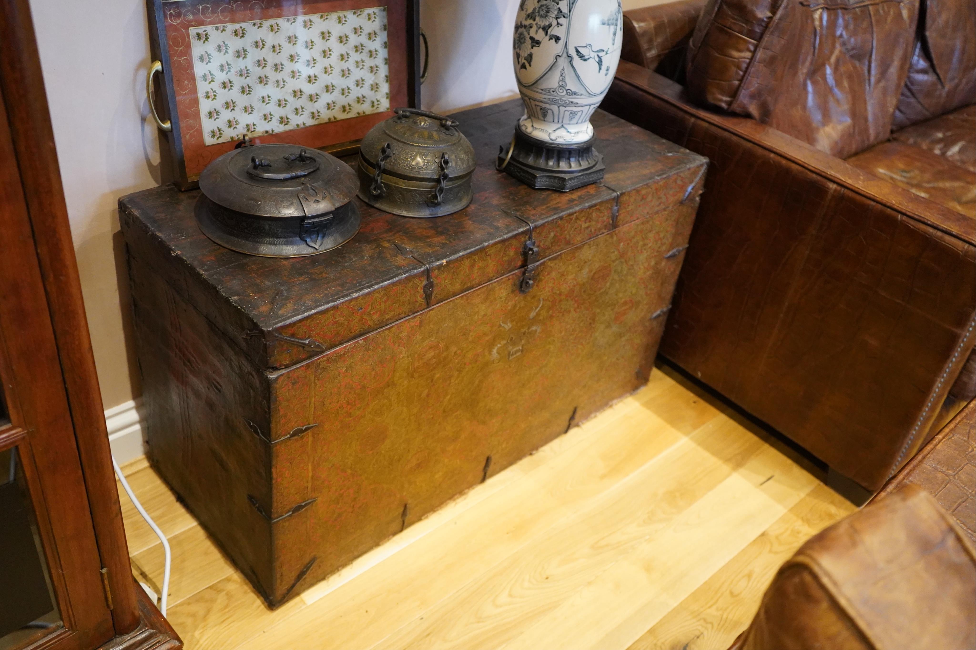 A pair of early 19th century Tibetan trunks, width 100cm, depth 42cm, height 57cm. Condition - poor